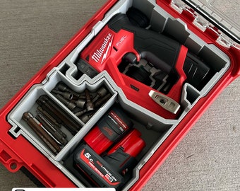May include: A red Milwaukee FUEL drill with a black and gray handle, two red 5.0 REDLITHIUM-ION batteries, and a variety of drill bits, all organized in a red and gray tool case.