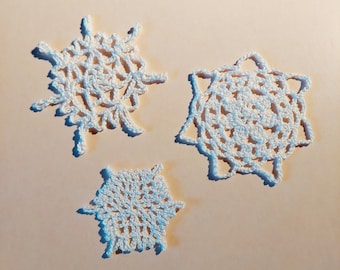 3 crocheted snowflakes