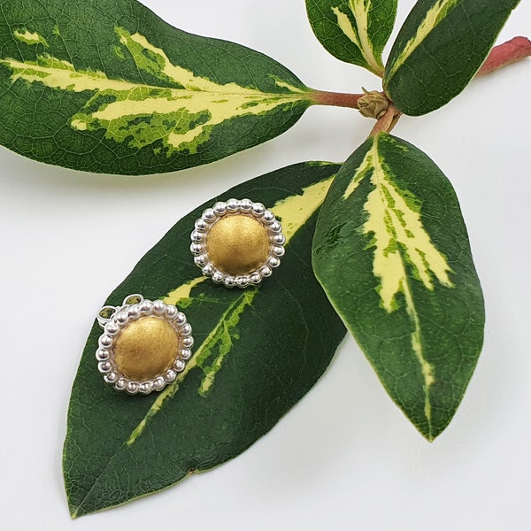 Silver stud earrings with fine gold support
