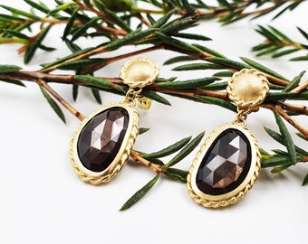 Gold stud earrings with brown sapphires