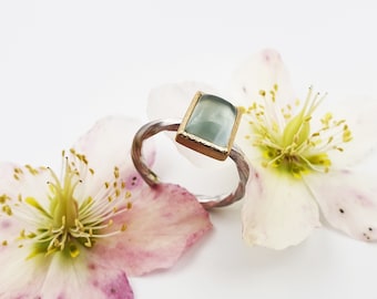 Silver ring with aquamarine in gold frame