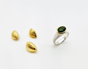 silver ring with tourmaline in gold setting
