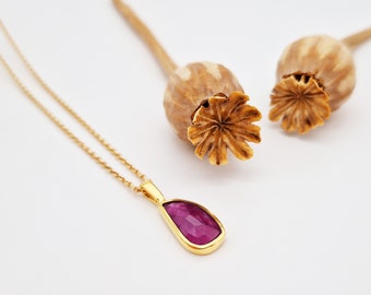 gold-plated pendant with ruby