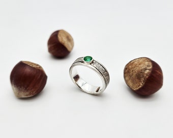 Silver ring with emerald