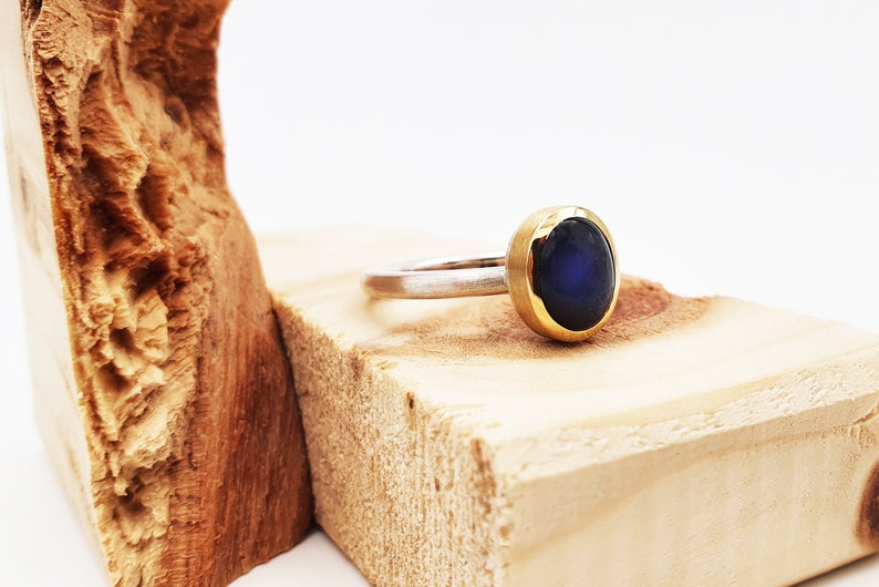 Silver ring with labradorite in gold setting image 3