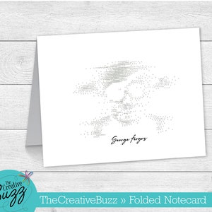 May include: A white folded notecard with a gray dot art design of a person's face. The text "George Fergus" is written below the design.