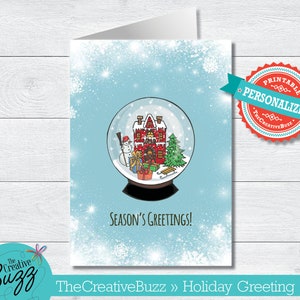 May include: A printable holiday greeting card featuring a snow globe with a red and white gingerbread house, a snowman, and a Christmas tree inside. The card has a blue background with white snowflakes and the text "SEASON'S GREETINGS!"