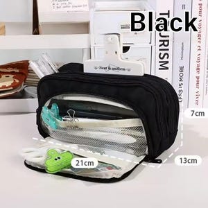 May include: A black rectangular pencil case with multiple zippered compartments and a clear mesh front panel. The case features a white clip labeled Neat & uniform on top. Dimensions are clearly marked as 21 inches by 13 inches by 7 inches.