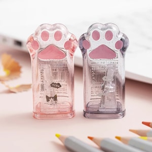1pc Sacapuntas de pata de gato, lindo sacapuntas de pata, mini sacapuntas transparente, escuela, cortador de papelería de oficina, suministros Kawaii, regalo