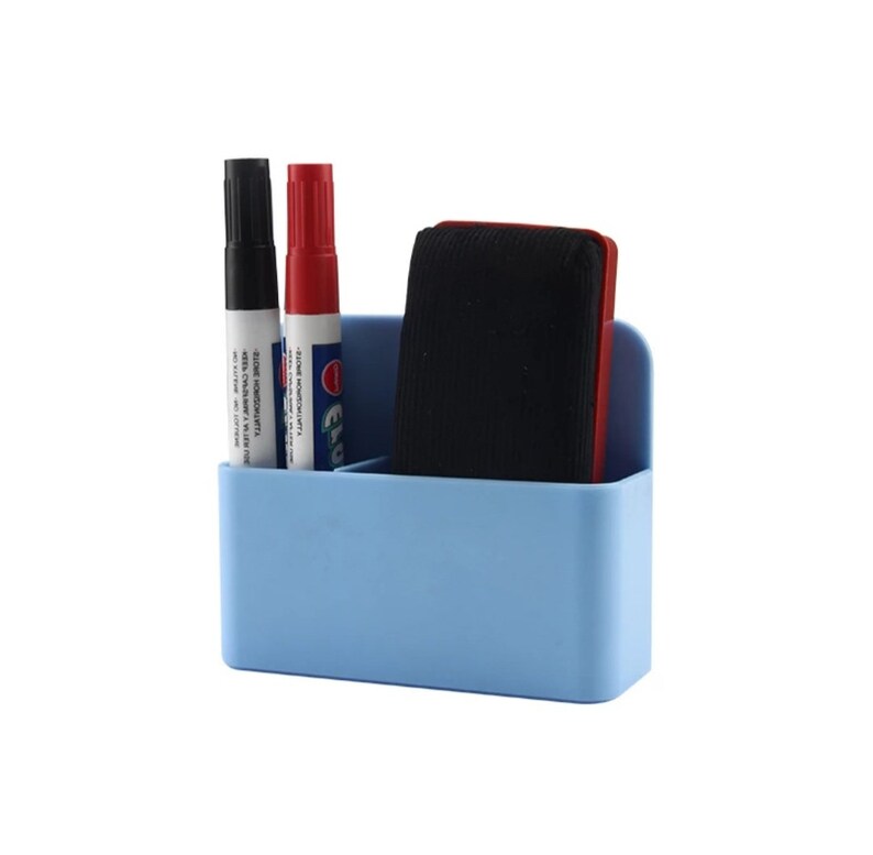 May include: A light blue plastic desk organizer holding a black marker, a red marker, and a black eraser. The organizer has two compartments and a curved back. The markers have white labels with black and red text.
