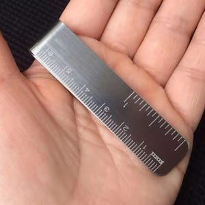 1 marcapáginas de metal, sujetapáginas, bloc de notas, material escolar y de oficina, minimarcapáginas, sujetapáginas.