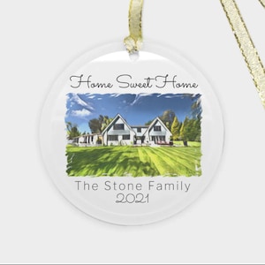 May include: A white glass ornament with a picture of a house and the text "Home Sweet Home" and "The Stone Family 2021".