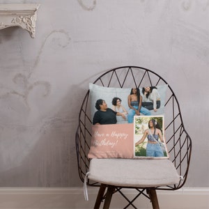 May include: A decorative pillow with a photo collage of four women. The pillow has a light pink section with the text "Have a Happy Birthday!" and a photo of one woman. The pillow is on a metal chair.