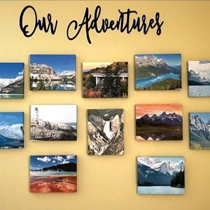 May include: A wall gallery of 15 framed landscape photographs featuring mountain scenes, lakes, and forests. The text "Our Adventures" is written in black cursive above the photos.