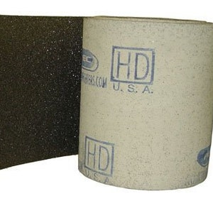 May include: A roll of black sandpaper with a white label that says "HD U.S.A."