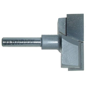 May include: A silver-coloured router bit with a straight shank and a T-shaped cutting head. The bit is labelled "WIMONA" on the shank.