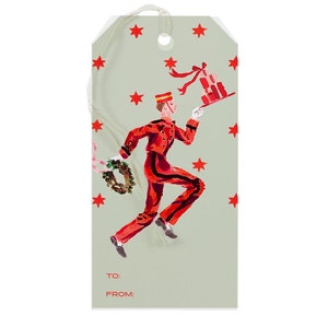 May include: A green gift tag with a red and black illustration of a bellhop carrying a stack of gifts. The tag has red stars and the text "TO:" and "FROM:" at the bottom.