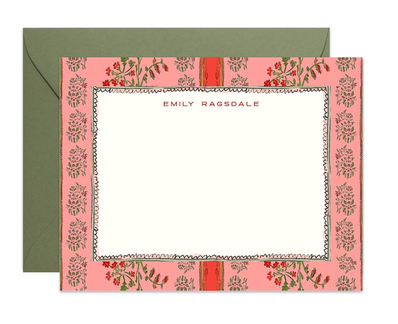 May include: A rectangular stationery card with a cream-coloured centre and a pink border featuring a repeating floral pattern in red and green. The name EMILY RAGSDALE is printed in red at the top centre. The card is paired with a solid olive green envelope.