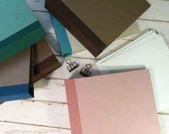 Paper-covered albums for square pages with linen spines in retro colors
