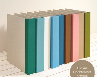 A4 album portrait format with colored linen spine and 2-fold mechanism as a layflat folder. Decorative for office or living area