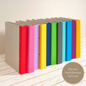 Álbum A4 formato retrato com lombada em linho colorido e mecanismo de dobra dupla como pasta plana. Decorativo para escritório ou sala de estar