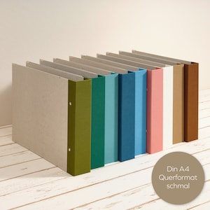 Álbum A4 formato paisagem com lombada em linho colorido e 2 mecanismos como pasta layflat. Decorativo para escritório ou sala de estar. Cores suaves