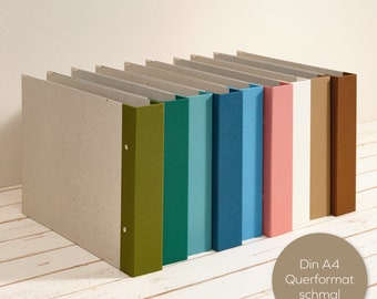 A4 album landscape format with colored linen spine and 2-fold mechanism as a layflat folder. Decorative for office or living area. Muted colors