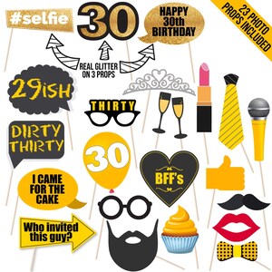 May include: A set of 23 photo booth props for a 30th birthday party. The props include a variety of fun and festive designs, such as a crown, glasses, a microphone, a mustache, a cupcake, and a heart that says "BFF's". There are also several props with the number 30 on them, including a balloon, a sign, and a number 30 with glitter.