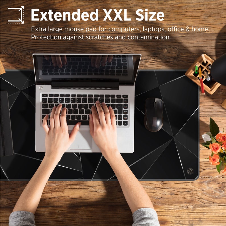 May include: A black and gray mouse pad with a geometric pattern. The mouse pad is large enough to fit a laptop and mouse. The text "Extended XXL Size" is at the top of the image. The text "Extra large mouse pad for computers, laptops, office & home. Protection against scratches and contamination." is below the title.