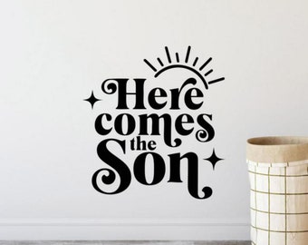 May include: Black and white vinyl wall decal with the text "Here comes the Son" and a stylized sun graphic.