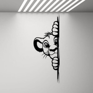 May include: Black and white illustration of a lion cub peeking around a corner. The lion cub has a playful expression on its face.