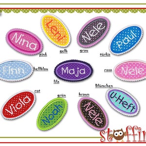 Könnte beinhalten: Eine bunte Tabelle mit ovalen Etiketten, die verschiedene Namen zeigen, jedes mit einer anderen Farbe und einem Tupfenmuster. Die Namen sind Leni, Nele, Paul, Nina, Finn, Maja, Viola, Noah und U-Heft. Die Tabelle enthält auch die deutschen Wörter für jede Farbe.