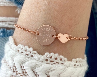 May include: A rose gold bracelet with a round charm that says "F&J LOVE M" and a heart charm.