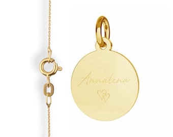 May include: Gold necklace with a round pendant engraved with the name "Annalena" and two small hearts.