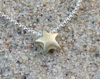 small star pendant with pea chain, yellow gold 333