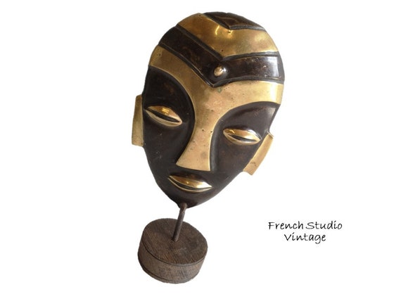 Buy Vintage Brass Face Mask: African Art Ornament on Wood  Vintage Brass Mask Face On Black Wood Base Made in India main image 0