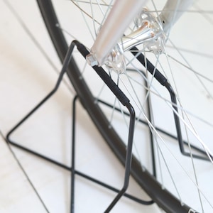 Stainless steel bike stand with spoke protection - black paint w/ black wrap | 26" - 27.5" - 28" wheels | metal bicycle rack