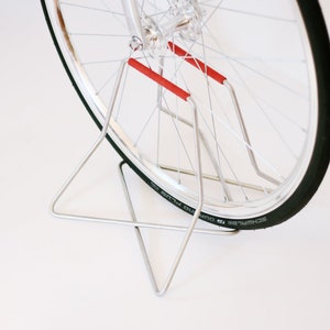 Stainless steel bike stand with spoke protection - red | 26&quot; - 27.5&quot; - 28&quot; wheels | S+Stand