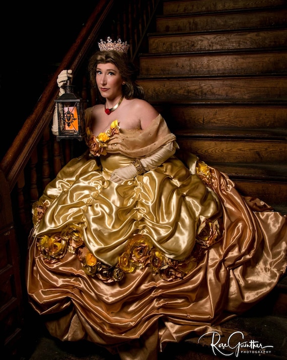 Belle in Disney Princess editorial photography. Image of gold