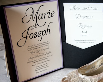 May include: A wedding invitation with the names "Marie and Joseph" in elegant script, alongside a pair of ivory lace peep-toe heels. Wedding rings are placed in the shoes, and a bouquet of flowers is in the background.