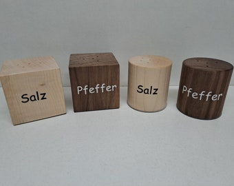 Salt and pepper shakers made of natural colored wood, round or square