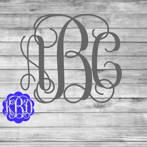 May include: A gray monogram design featuring the letters "RBC" in a flowing, elegant script. A smaller blue monogram with the letters "KBD" is in the lower left corner. The design is set against a light gray wooden background.