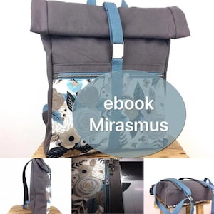 Könnte beinhalten: Ein grauer Canvas-Rucksack mit einem blauen Riemen und einer Tasche aus Blumenstoff. Der Rucksack hat einen Rollverschluss und eine Reißverschlusstasche vorne. Der Text "ebook Mirasmus" befindet sich auf einem blauen Kreis vor dem Rucksack.