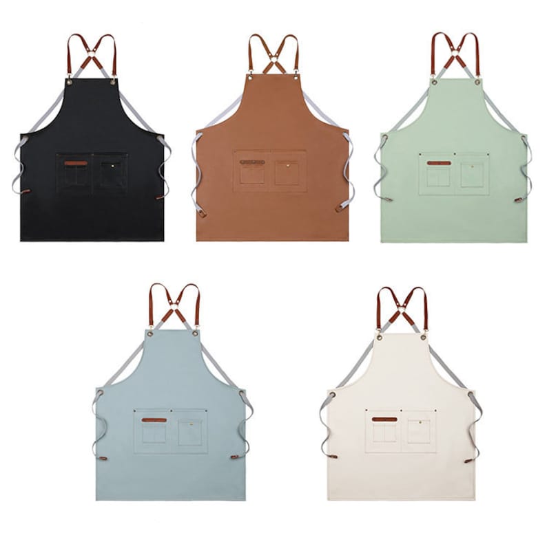 May include: Five different coloured aprons with adjustable straps and two pockets. The aprons are black, brown, green, light blue, and white.