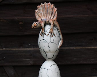 Ceramic Ball stele egg-shaped elements on top with small dragon lizard unglazed ceramic work Height 1.59 m