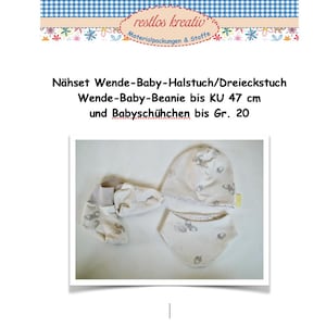 May include: A baby clothing set featuring a reversible bib, beanie, and booties. The set is cream-colored with a subtle pattern of small, gray illustrations. The text on the image reads "restlos kreativ" and details the items included.