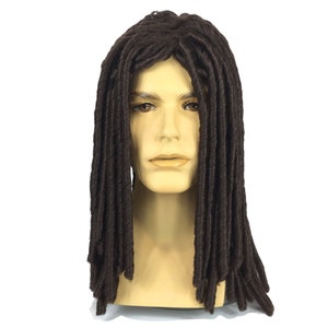 May include: A brown dreadlock wig displayed on a mannequin head. The wig features long, thick, and dark brown dreadlocks. The mannequin head is a neutral skin tone, and the background is plain white.