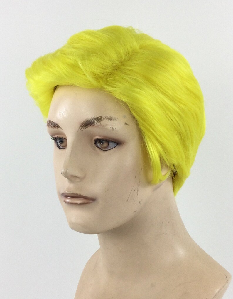 May include: A short, bright yellow wig with a side part and a textured finish.