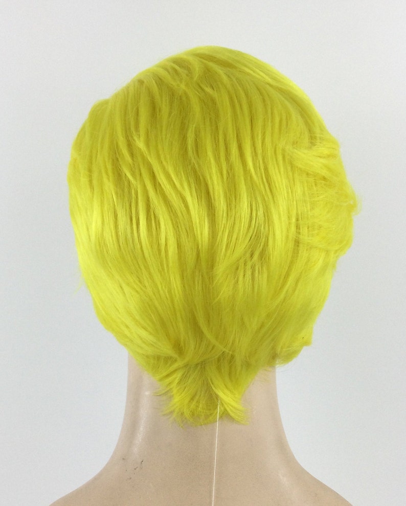 May include: A short, bright yellow wig with a side part and textured layers.