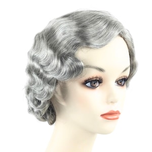 May include: A gray wig styled in a vintage, wavy design. The wig is on a mannequin head with detailed facial features, including dark eyelashes and a neutral lip color. The hair has a classic, retro look.